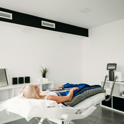 relaxed-woman-enjoying-in-pressotherapy-treatment-at-wellness-center-.jpg